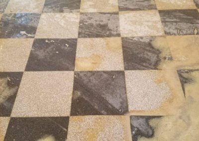 A dusty black and white checkered floor in a room